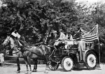 Fire Dept pumper in July 4th parade ca 1915