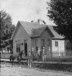 Dr. E.L. Denison by horse in front of his office in Marion, Illinois ca 1880. Unknown Goodall standing on walk. Photo courtesy of the Williamson County Museum
